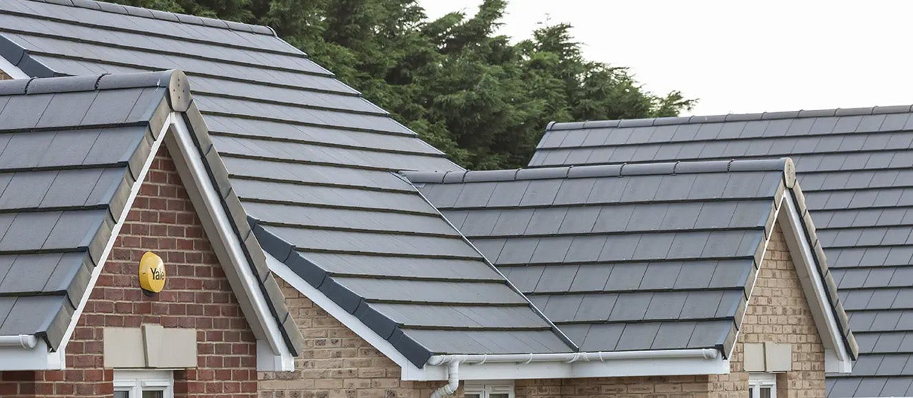 house with grey double-pitched roof design