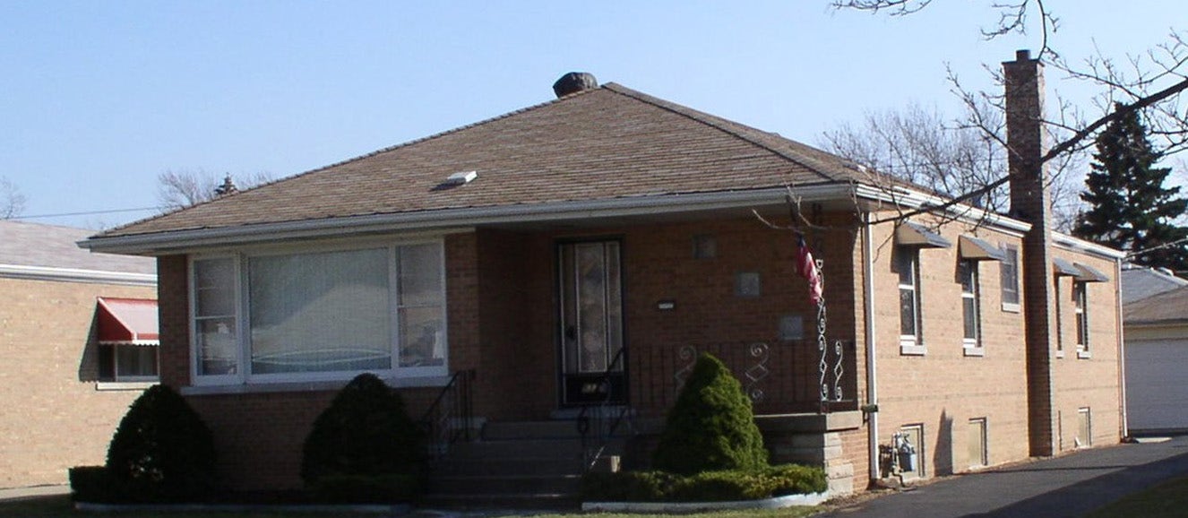 single-floor brick house with hip-pitched roof